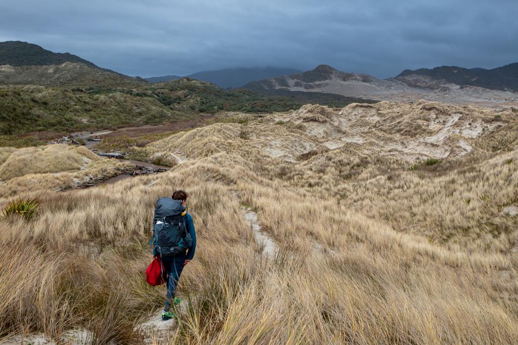 Jen walking up to Mason Bay Hut.