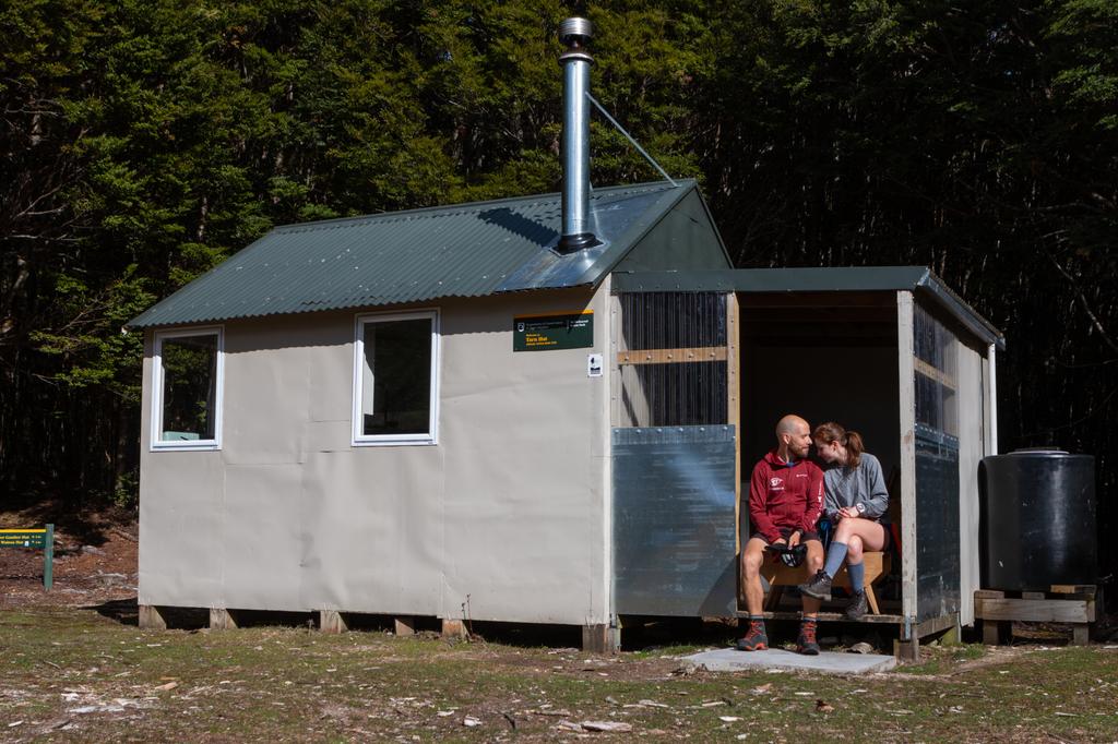 Madatory cute hut photo before leaving on Day 2.