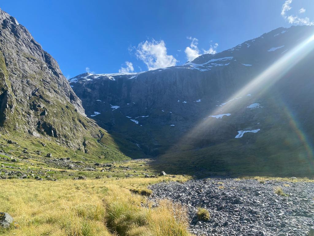 Looking up the valley. Track goes to the left in the sun.