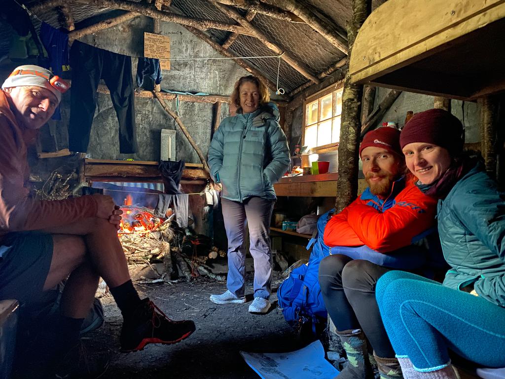 Justin, Francie, Finn and Jen cosy inside Kay Creek Hut