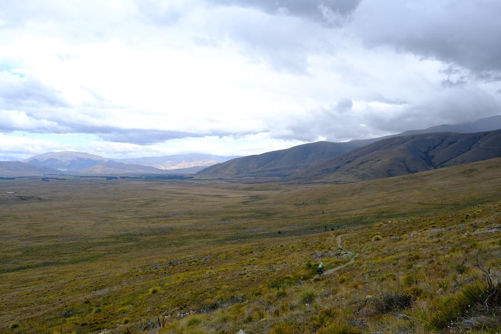 Em cycling into the distance on Tarnbrae Track.