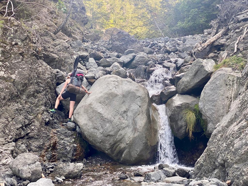 Jen clambering up one of the two rather large boulders!