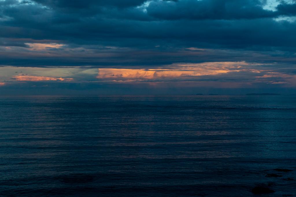 The sun going down at Christmas Village Hut.