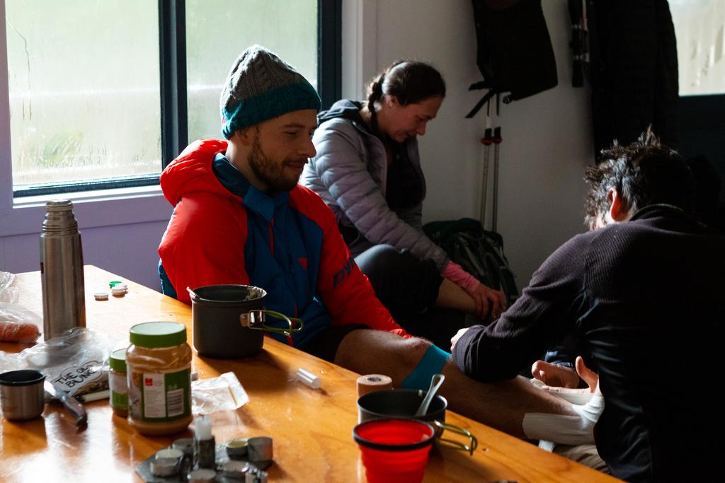 Tommy the French physio strapping my ankle at Edwards Hut.