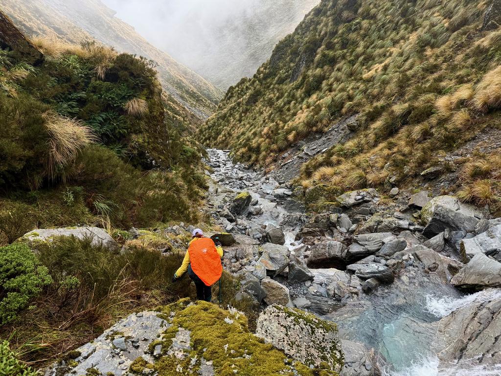 Clambering down the creek that becomes Kokatahi River.