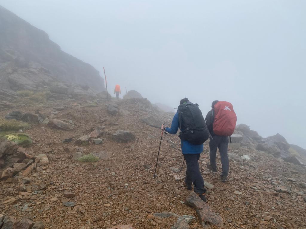 Cloudy ridgeline at the top.