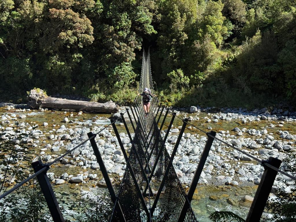 Jen on Scotty's 3-wire bridge which has replaced the cableway.