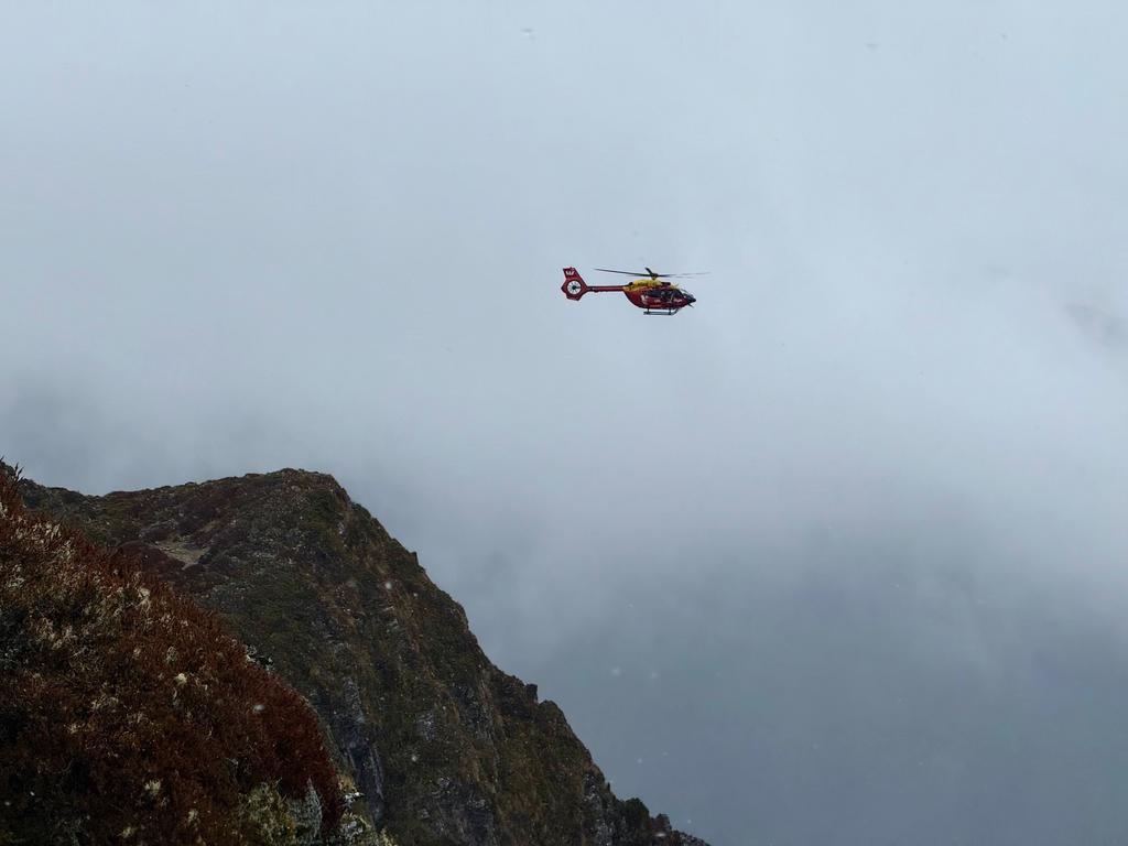 The Westpac Rescue Helicopter came and watched us climb the chain ladder and summit point 1496. It just hung around. Weird.