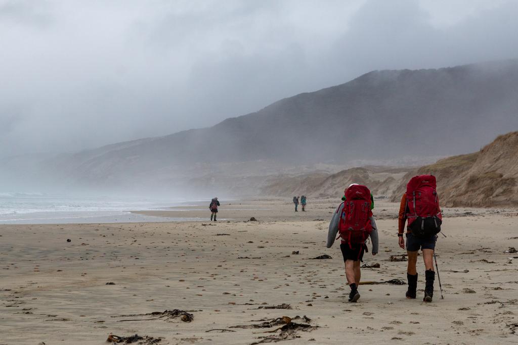 Heading along Mason Bay in the gloom.